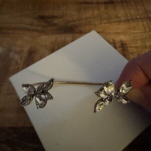 Crystal cuff with floral/butterfly accents